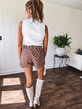 Washed light brown wrap skort with cream polka dots throughout elastic back with back pockets and side pockets.