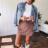 Washed light brown wrap skort with cream polka dots throughout elastic back with back pockets and side pockets.