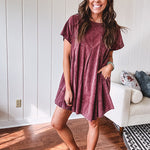 Washed wine mini dress with relaxed, pleated design and pockets, short sleeves.