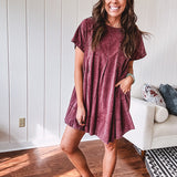Washed wine mini dress with relaxed, pleated design and pockets, short sleeves.