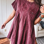 Washed wine mini dress with relaxed, pleated design and pockets, short sleeves.