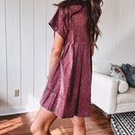 Washed wine mini dress with relaxed, pleated design and pockets, short sleeves.