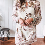 Mini dress in ivory with vintage floral design, fully lined, sheet long sleeves, lace detail at the eyelet neckline and collar and hem. Zip up back.
