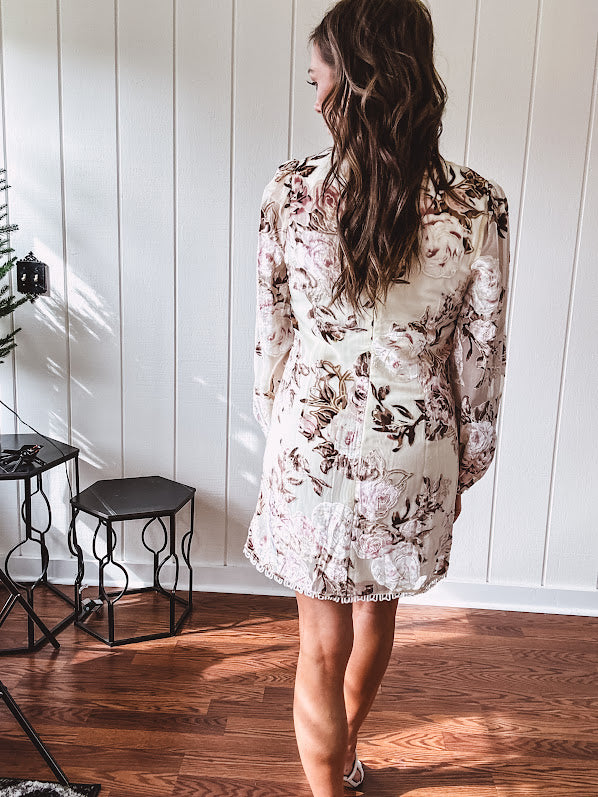Mini dress in ivory with vintage floral design, fully lined, sheet long sleeves, lace detail at the eyelet neckline and collar and hem. Zip up back.