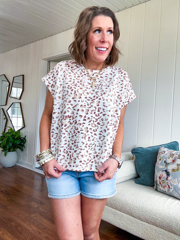 Soft cream tee with taupe and brown leo print throughout.