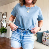 Buttery soft, thin tee with exposed seams and round neck and U shaped hem.