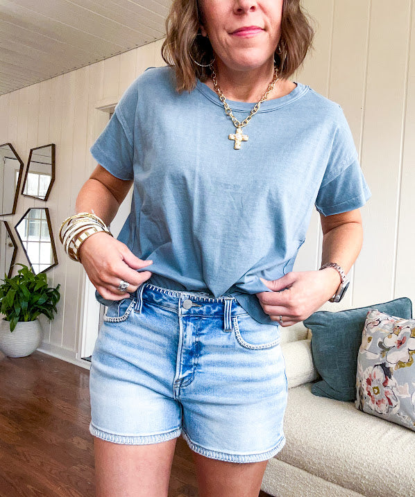 Buttery soft, thin tee with exposed seams and round neck and U shaped hem.