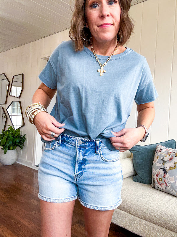 Buttery soft, thin tee with exposed seams and round neck and U shaped hem.