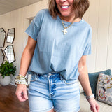 Buttery soft, thin tee with exposed seams and round neck and U shaped hem.
