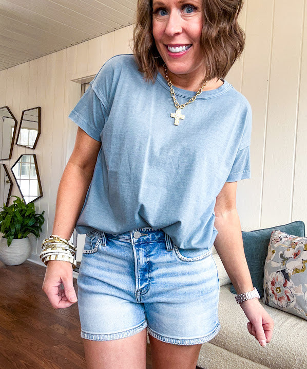 Buttery soft, thin tee with exposed seams and round neck and U shaped hem.