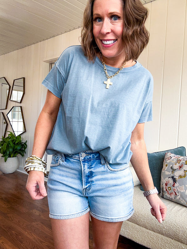 Buttery soft, thin tee with exposed seams and round neck and U shaped hem.