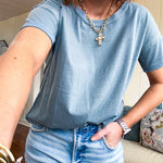Buttery soft, thin tee with exposed seams and round neck and U shaped hem.