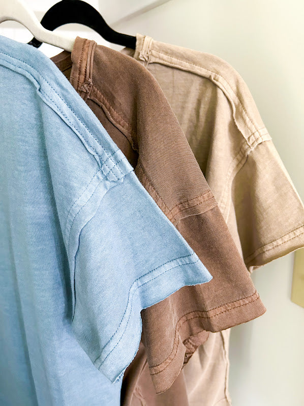 Buttery soft, thin tee with exposed seams and round neck and U shaped hem.