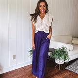 Navy wide leg satin pants with elastic waistband and pockets