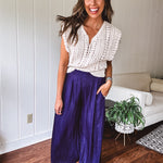 Navy wide leg satin pants with elastic waistband and pockets
