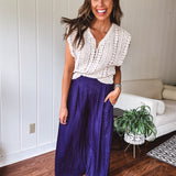 Navy wide leg satin pants with elastic waistband and pockets