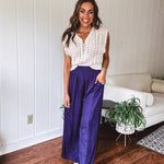 Navy wide leg satin pants with elastic waistband and pockets