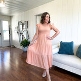 Apricot midi dress with smocked bodice, ruffle sleeves and tiered lined skirt.