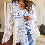 White window pane crochet long sleeved button up with indigo floral details at the yoke, pockets and placket and embroidered crochet throughout.