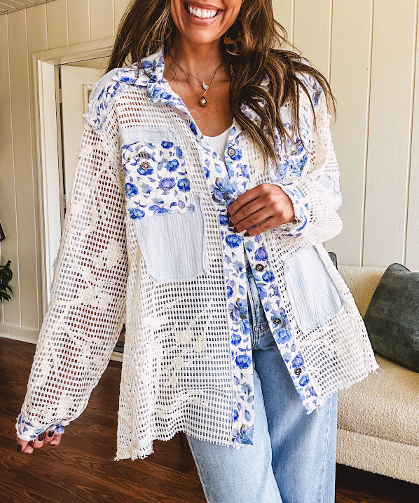 White window pane crochet long sleeved button up with indigo floral details at the yoke, pockets and placket and embroidered crochet throughout.