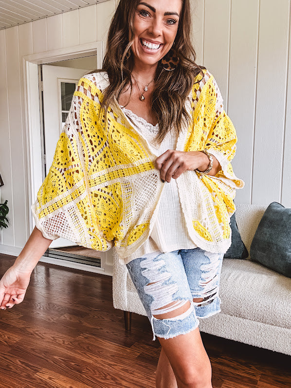 Short 3/4 sleeve yellow and cream crochet batwing cardigan.