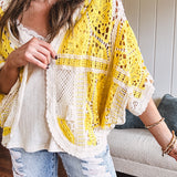 Short 3/4 sleeve yellow and cream crochet batwing cardigan.