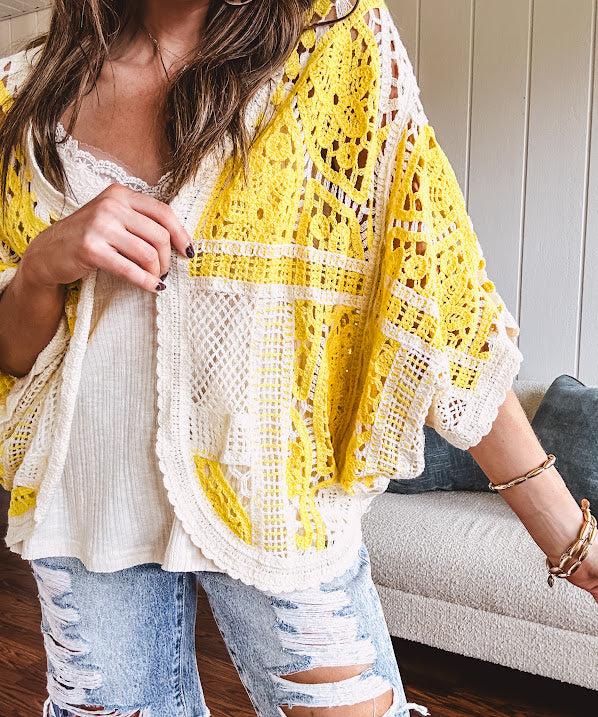 Short 3/4 sleeve yellow and cream crochet batwing cardigan.