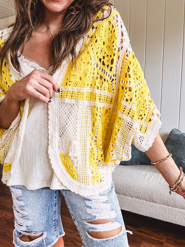 Short 3/4 sleeve yellow and cream crochet batwing cardigan.