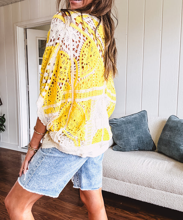 Short 3/4 sleeve yellow and cream crochet batwing cardigan.