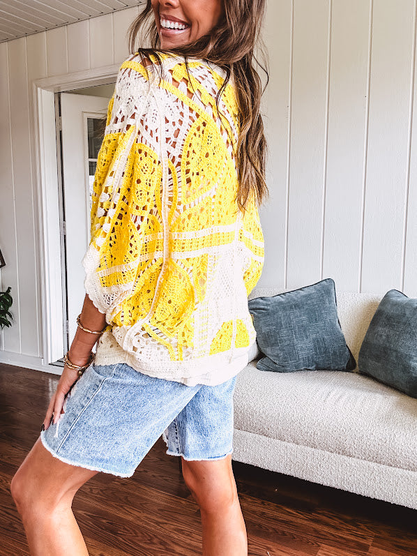 Short 3/4 sleeve yellow and cream crochet batwing cardigan.