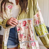 Olive washed duster length button up shirt with collar, long sleeves and multi colored paste floral patchwork and lace detail throughout.