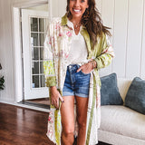 Olive washed duster length button up shirt with collar, long sleeves and multi colored paste floral patchwork and lace detail throughout.