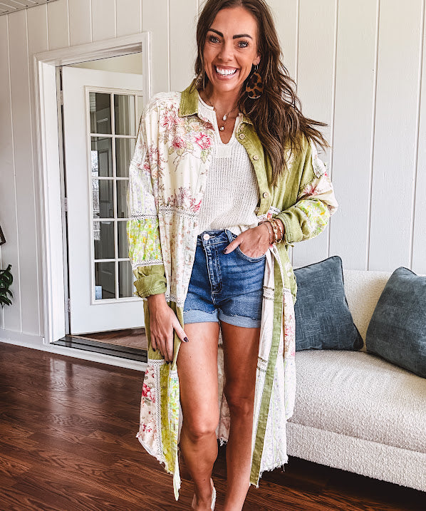 Olive washed duster length button up shirt with collar, long sleeves and multi colored paste floral patchwork and lace detail throughout.