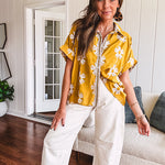 Ecru cropped wide leg pants with barrel stitching on the inner knees, contrast stitching and zero stretch.