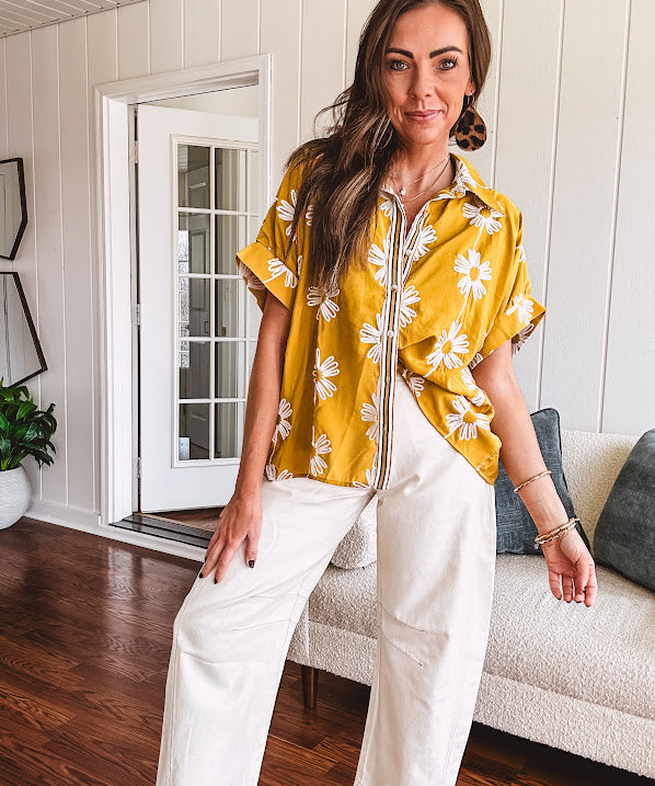 Ecru cropped wide leg pants with barrel stitching on the inner knees, contrast stitching and zero stretch.