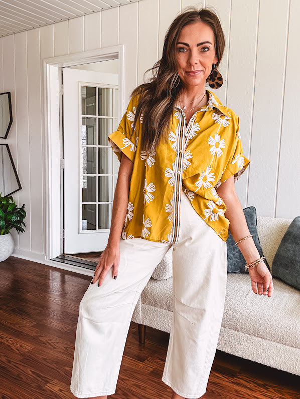 Ecru cropped wide leg pants with barrel stitching on the inner knees, contrast stitching and zero stretch.