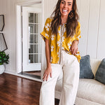 Ecru cropped wide leg pants with barrel stitching on the inner knees, contrast stitching and zero stretch.