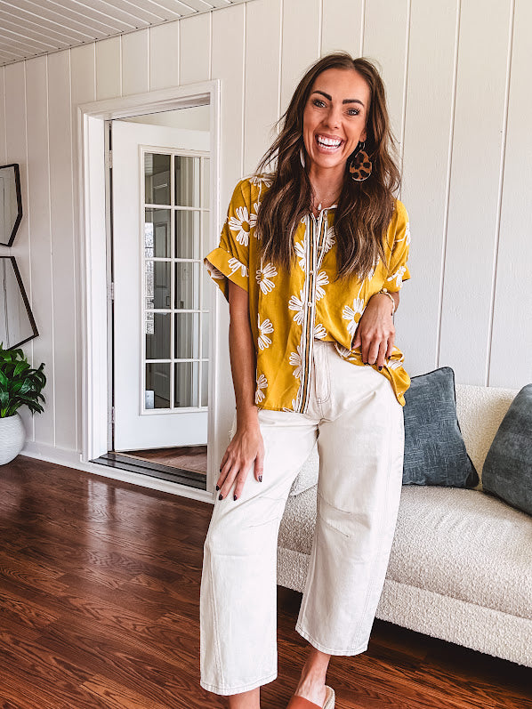 Ecru cropped wide leg pants with barrel stitching on the inner knees, contrast stitching and zero stretch.