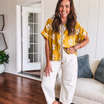 Ecru cropped wide leg pants with barrel stitching on the inner knees, contrast stitching and zero stretch.