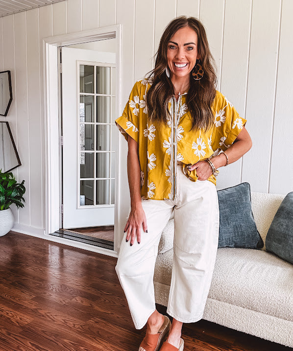 Ecru cropped wide leg pants with barrel stitching on the inner knees, contrast stitching and zero stretch.