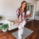 Mauve, black and white abstract print chiffon button down top with 3/4 sleeves.