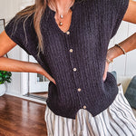 Textured black woven sweater tank with faux wooden buttons down the front and a V neck and hem.