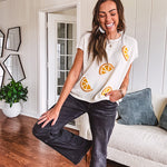 Lightweight cream woven sweater with short, capped sleeves and knitted lemon appliques on the front.