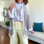 Stretchy lemon colored cropped wide leg pants with scallop trimmed front pockets and button and zipper closure