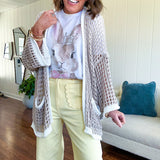 Stretchy lemon colored cropped wide leg pants with scallop trimmed front pockets and button and zipper closure