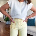 Soft, lightweight and thin cap sleeved button front sweater.