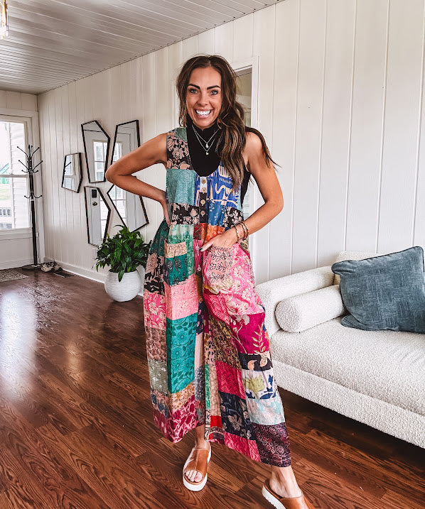 Soft ribbed textured turtleneck tank sweater.