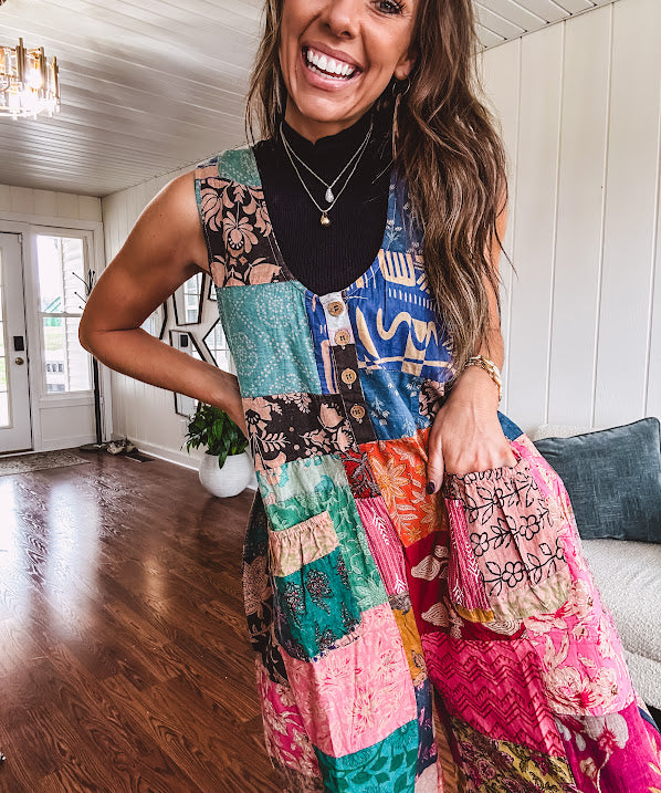 Soft ribbed textured turtleneck tank sweater.