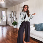 Thin, lightweight black wide leg pants with elastic waist and textured fabric.