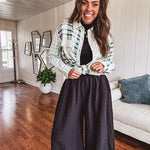 Thin, lightweight black wide leg pants with elastic waist and textured fabric.